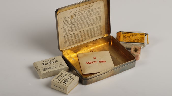 A first aid kit in a tin, which dates back to the early 20th century